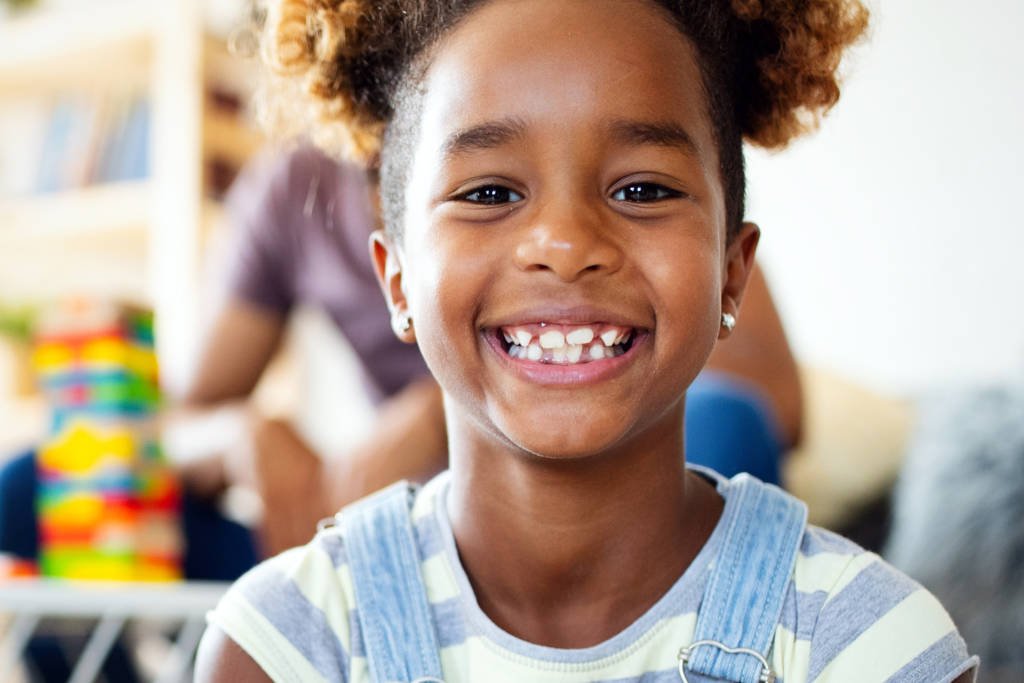 Beautiful portrait of a happy little african american girl smiling