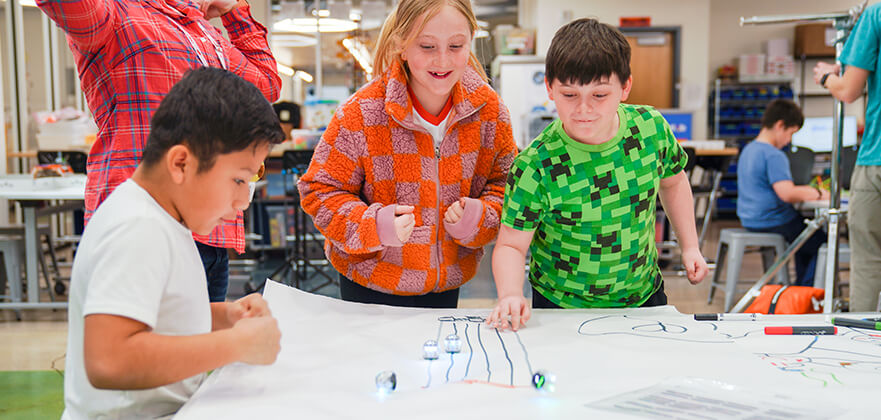 McAuliffe-Academy-students-working-on-an-Ozobot-project.