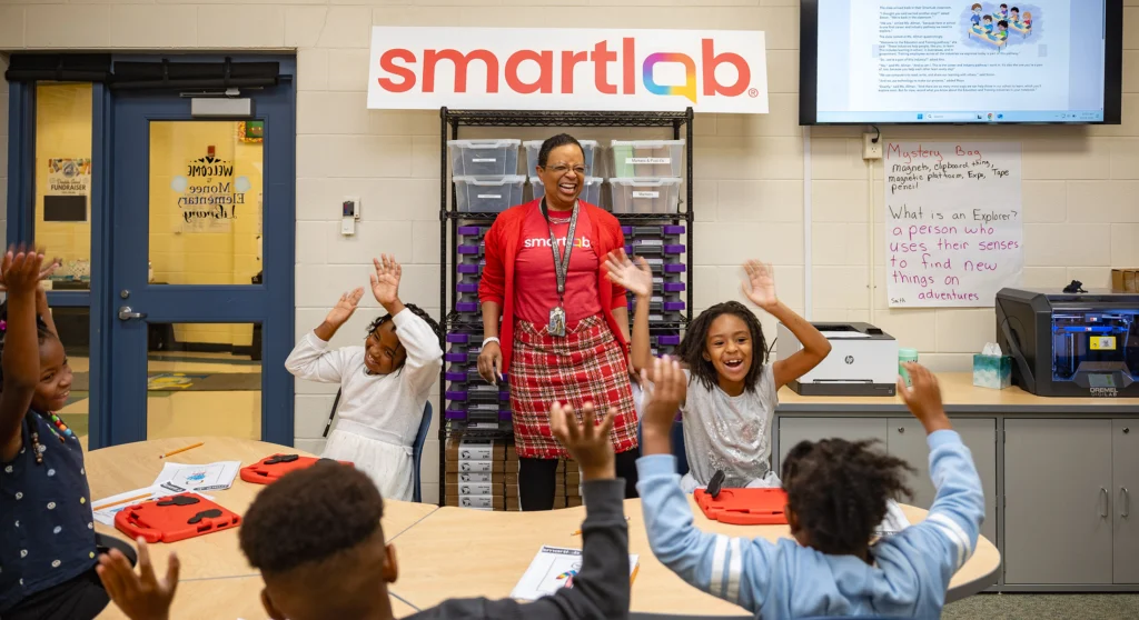 Dr. Ghantel Perkins Assistant Superintendent of Crete Monee School District 201U in Crete Illinois celebrates with students at the SmartLab Ribbon Cutting Ceremony